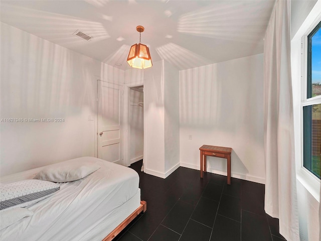 bedroom with multiple windows
