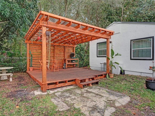 wooden deck featuring a pergola