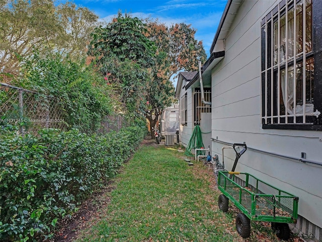 view of yard featuring central AC unit