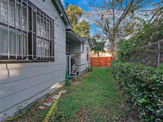 view of side of home featuring a lawn