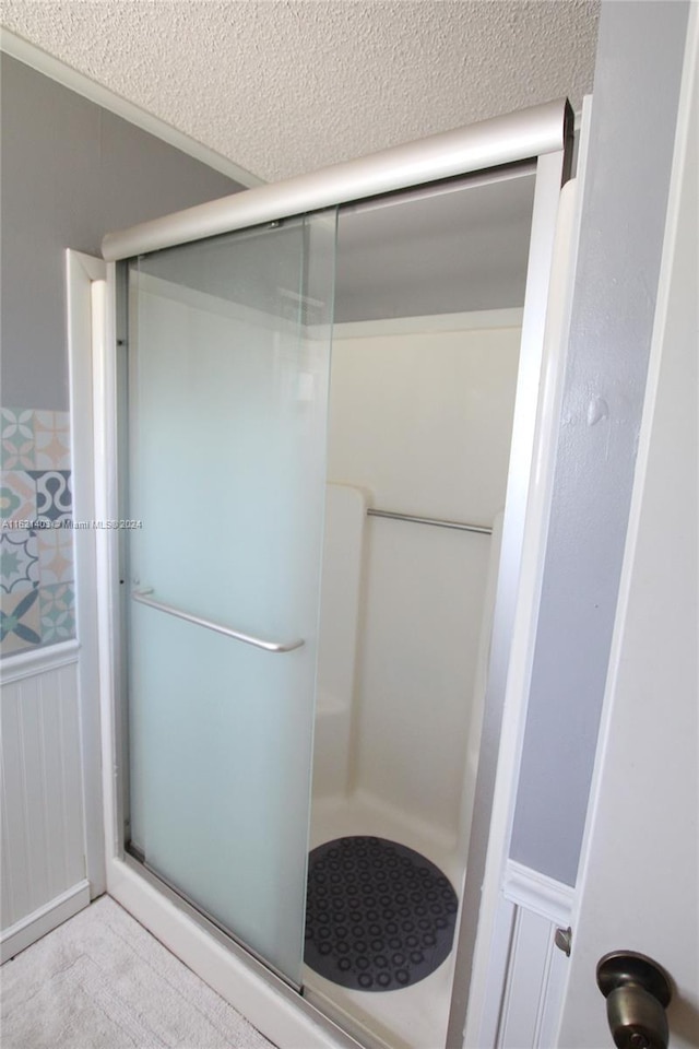 bathroom featuring an enclosed shower