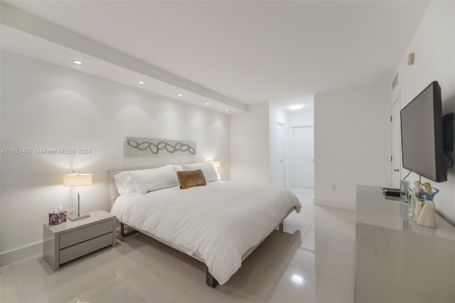 bedroom with light tile patterned floors