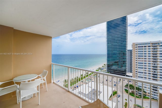 balcony with a view of the beach and a water view