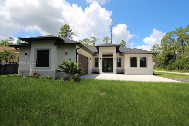 rear view of property with a yard