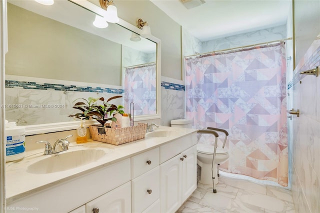 bathroom with dual vanity, tile walls, toilet, and tile patterned flooring