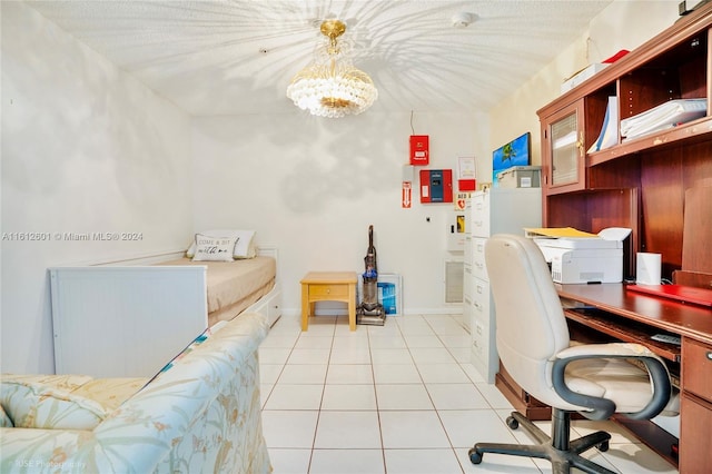 tiled home office with an inviting chandelier and a textured ceiling