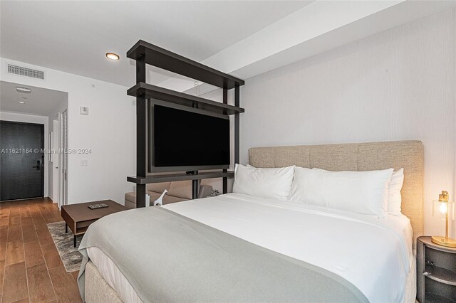 bedroom featuring wood-type flooring