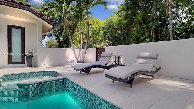 view of swimming pool with a patio