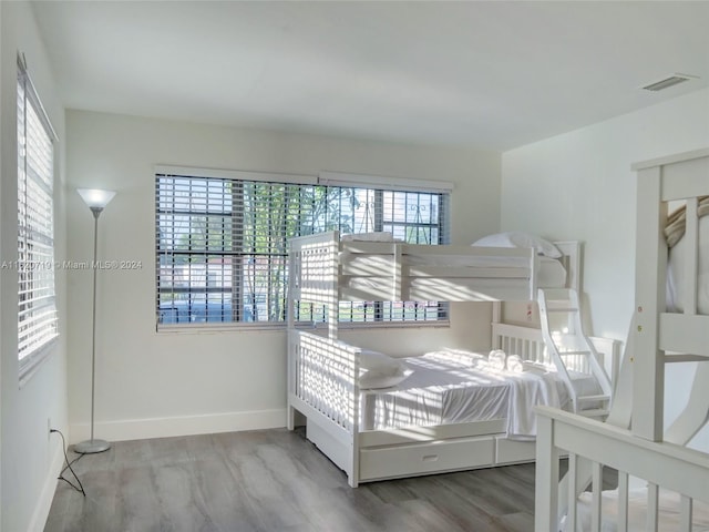 bedroom featuring hardwood / wood-style flooring