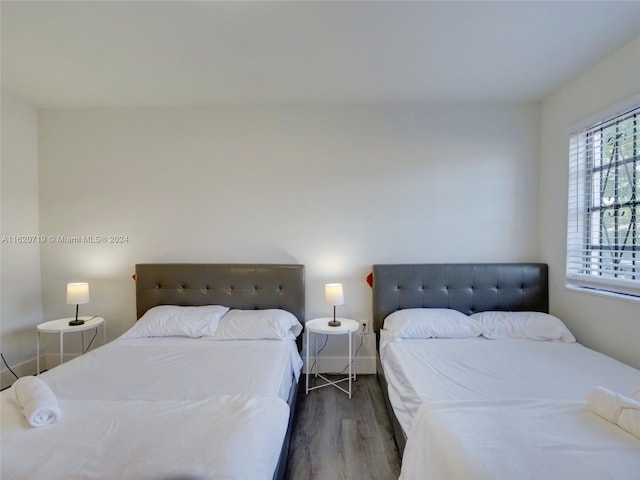 bedroom featuring dark hardwood / wood-style flooring