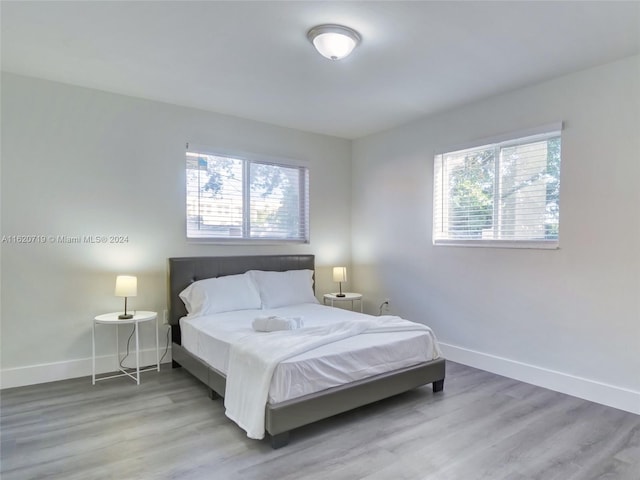 bedroom with light hardwood / wood-style flooring