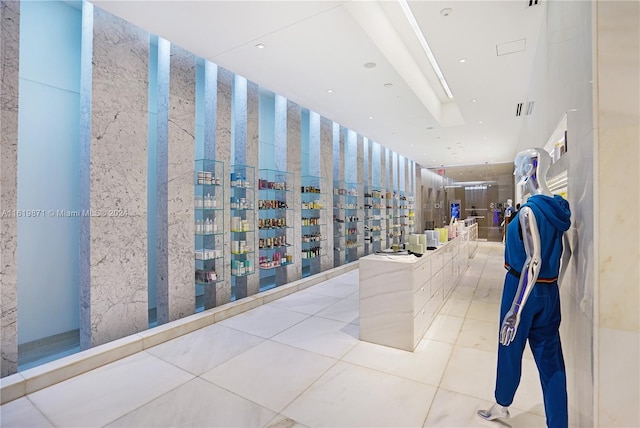 hall with light tile patterned floors