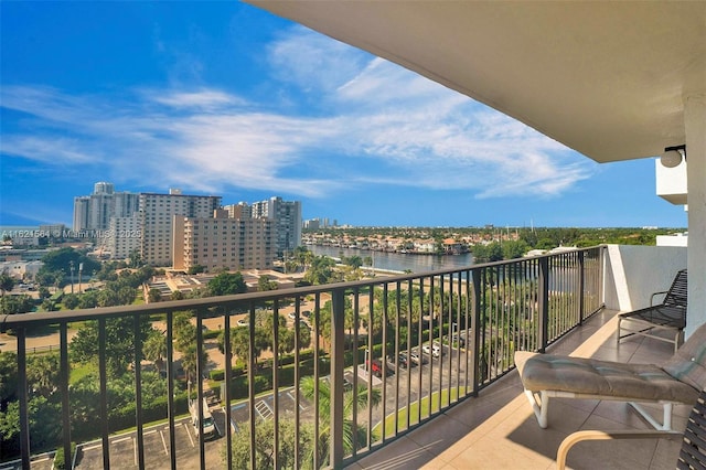 balcony with a water view and a city view