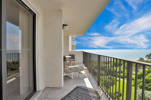 birds eye view of property featuring a water view and a view of the beach