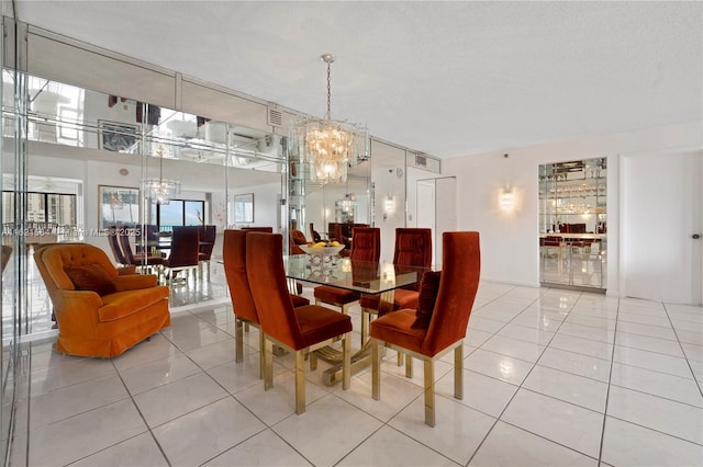 tiled dining room with visible vents, a notable chandelier, and a textured ceiling