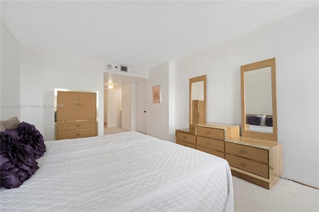 bedroom with light carpet and visible vents