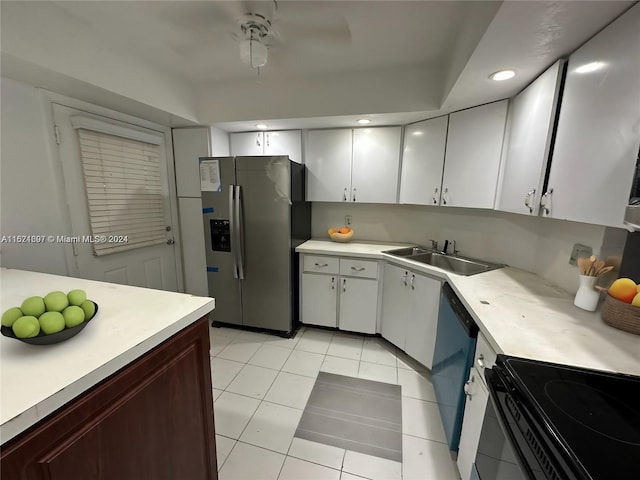 kitchen featuring dishwasher, light tile patterned floors, stainless steel refrigerator with ice dispenser, white cabinetry, and ceiling fan