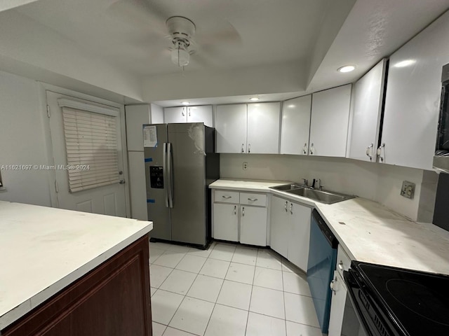 kitchen featuring sink, white cabinetry, black appliances, and light tile patterned floors