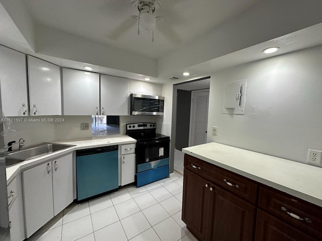 kitchen with stainless steel appliances, dark brown cabinets, sink, light tile patterned floors, and ceiling fan