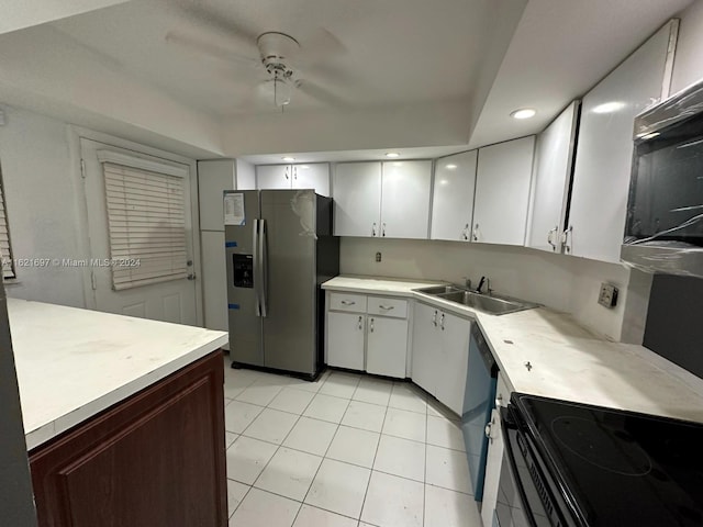 kitchen featuring light tile patterned floors, white cabinets, stainless steel refrigerator with ice dispenser, ceiling fan, and sink