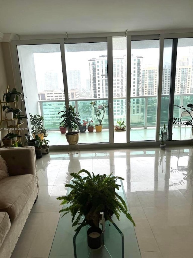 living room with plenty of natural light and tile patterned flooring