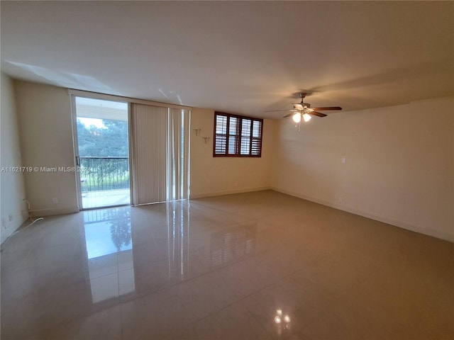 unfurnished room with ceiling fan