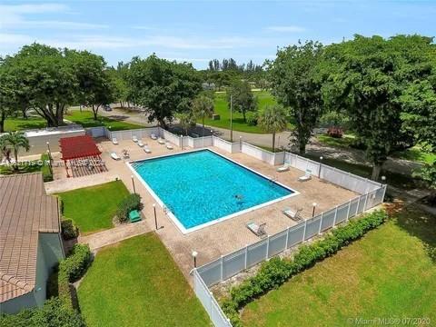 view of pool featuring a patio area and a lawn