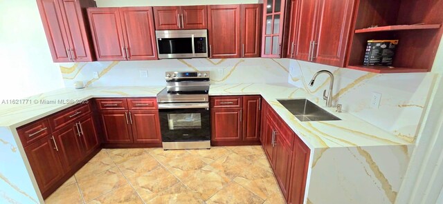 kitchen featuring light tile patterned flooring, stainless steel refrigerator with ice dispenser, and electric panel