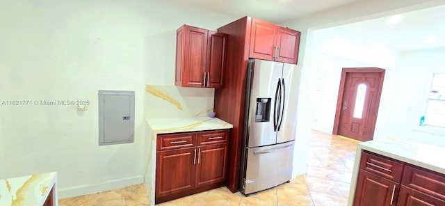 kitchen with electric panel and stainless steel fridge with ice dispenser