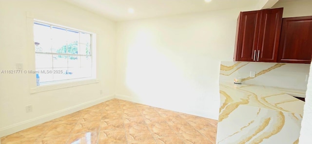 spare room with light tile patterned floors