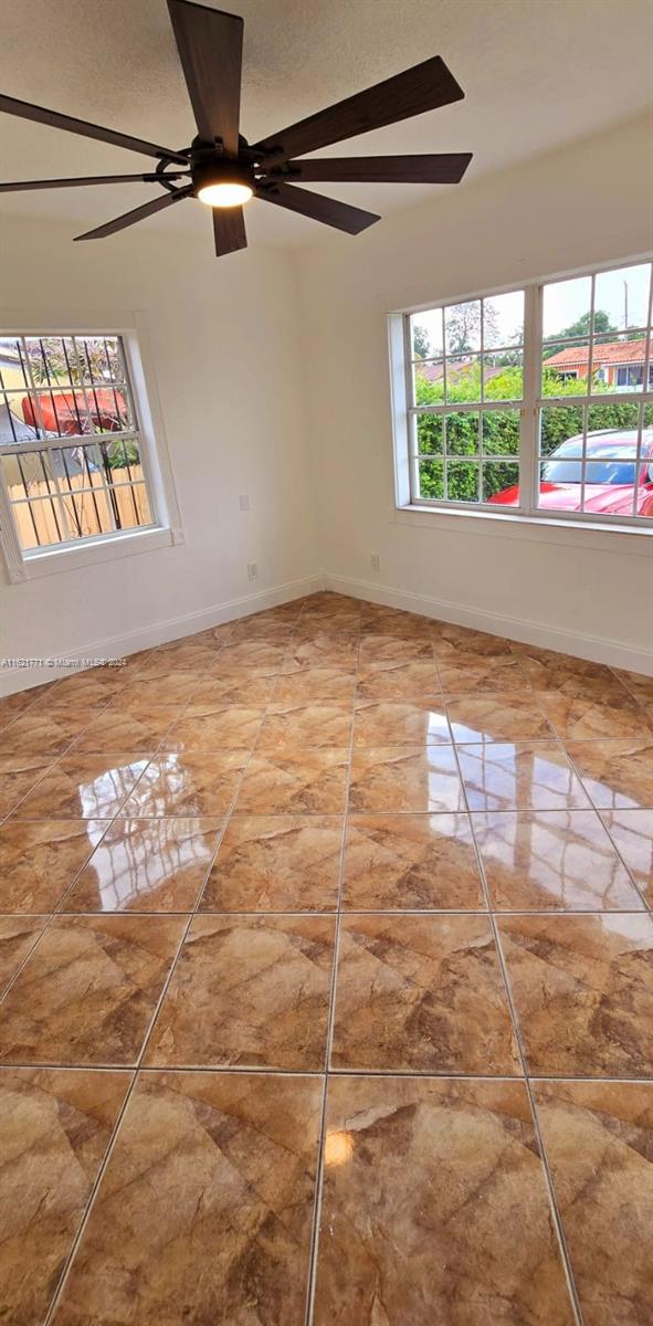 spare room with ceiling fan