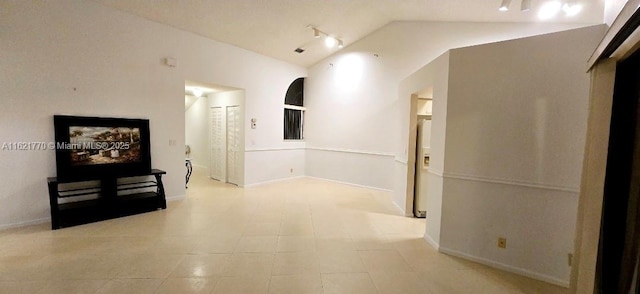 hallway with lofted ceiling