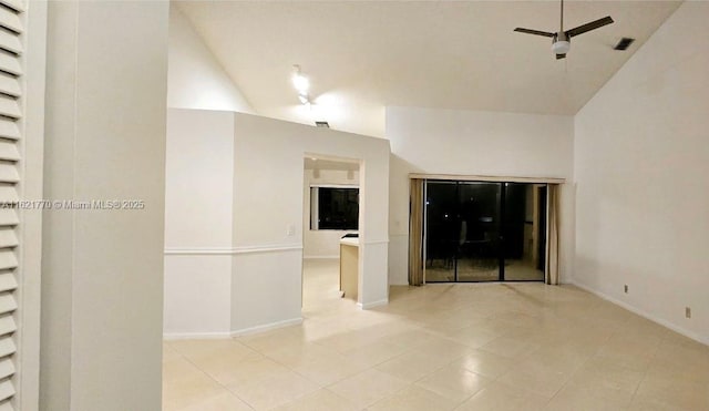 unfurnished living room featuring ceiling fan, light tile patterned flooring, and lofted ceiling