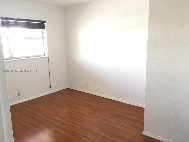 6707 N Kendall Dr Unit 115, Pinecrest, FL 33156 - unfurnished room with dark wood-style floors and baseboards