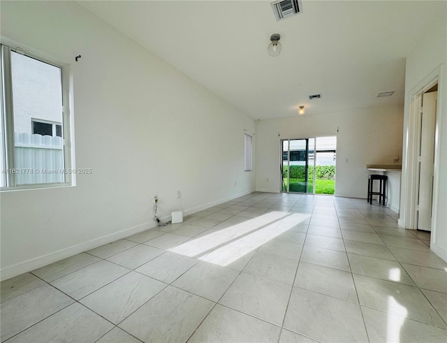 1727 SE 8th Pl Unit 1727, Homestead, FL 33034 - unfurnished living room with light tile patterned floors and baseboards