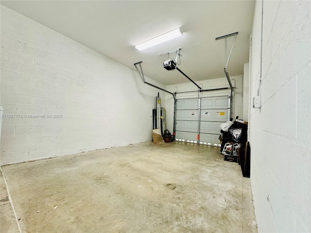 1727 SE 8th Pl Unit 1727, Homestead, FL 33034 - garage featuring a garage door opener and concrete block wall