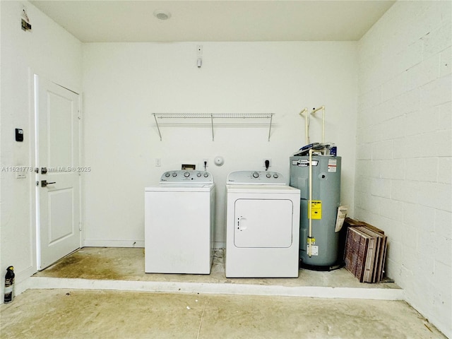 laundry room with water heater and independent washer and dryer