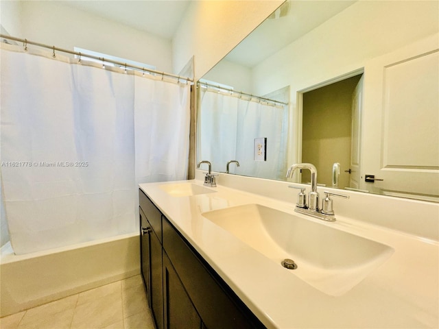 bathroom with shower / tub combo with curtain, tile patterned floors, and vanity