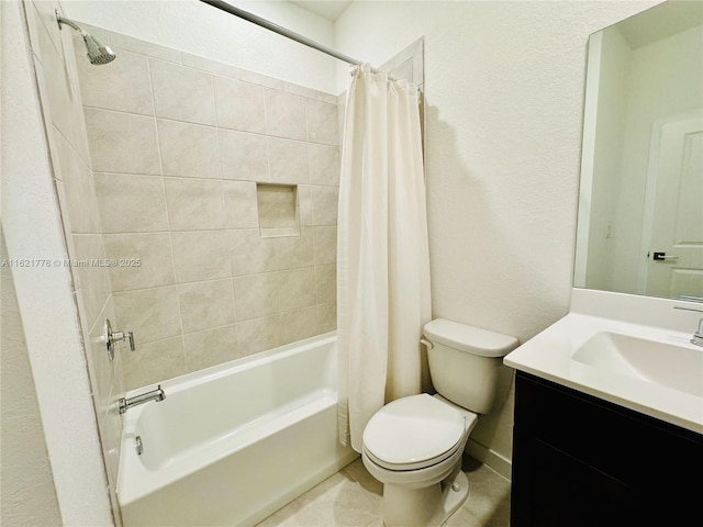 full bathroom with vanity, shower / tub combo with curtain, tile patterned floors, and toilet