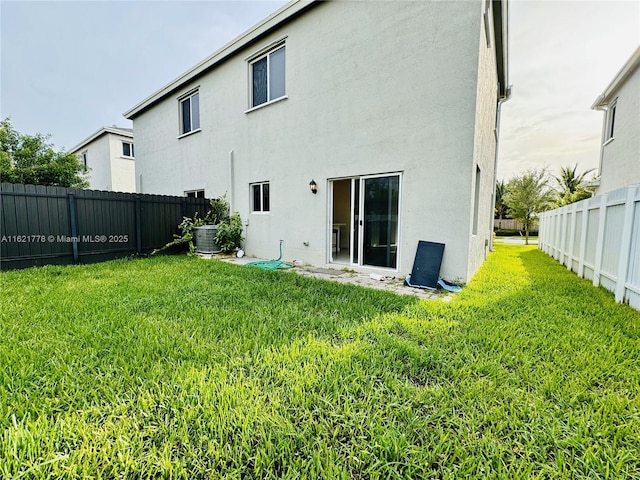 1727 SE 8th Pl Unit 1727, Homestead, FL 33034 - back of property featuring a fenced backyard and stucco siding