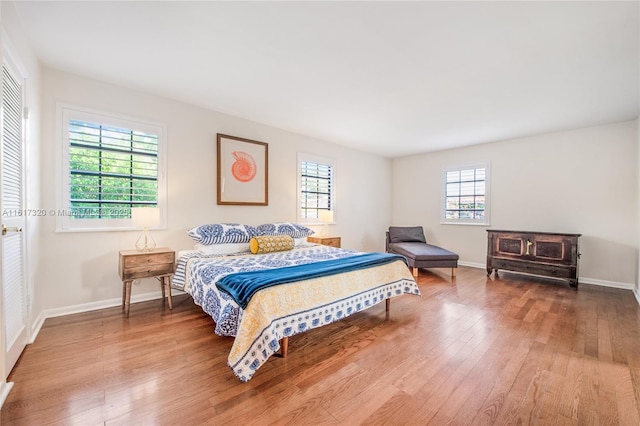 bedroom with hardwood / wood-style flooring