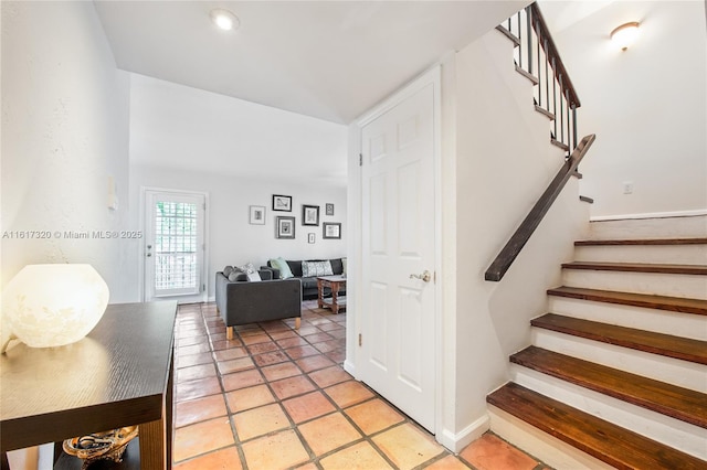 stairs featuring tile patterned flooring