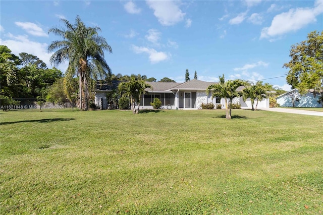 ranch-style home with a front lawn