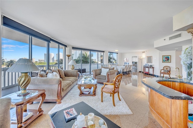 living room featuring floor to ceiling windows