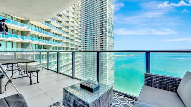 balcony featuring a water view