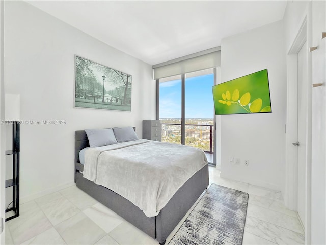 bedroom with floor to ceiling windows