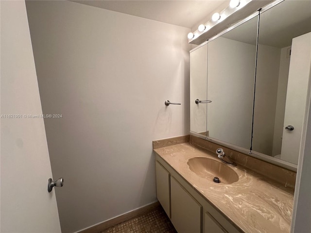 bathroom with vanity and tile patterned flooring