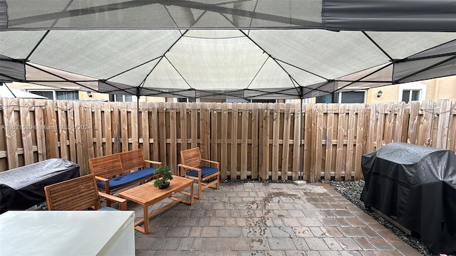 view of patio featuring a grill