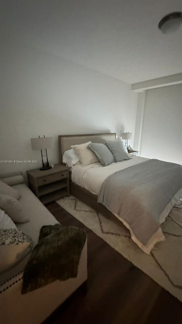 bedroom with wood-type flooring