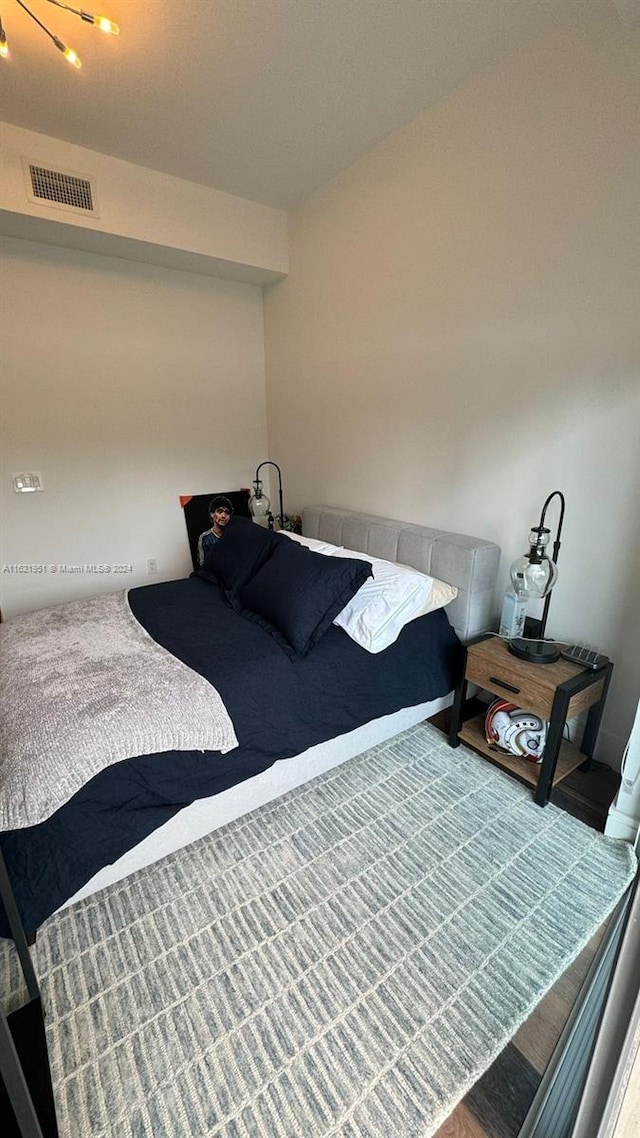 bedroom featuring hardwood / wood-style floors